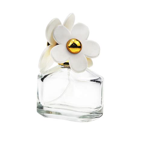 white perfume bottle with flowers